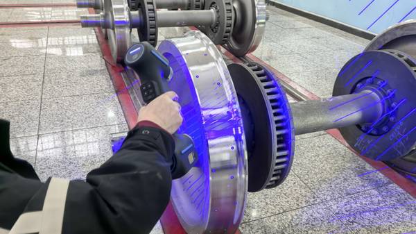 INSVISION AlphaScan 3D scanner scanning a train wheel hub